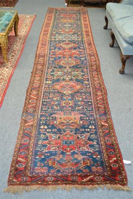 Lot 1260 - Narrow North West Persian Runner Persian Azerbaijan The mid indigo field with a single column...