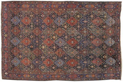 Lot 1262 - Afshar Carpet South East Persia The polychrome diamond lattice field of stylised flowerheads...