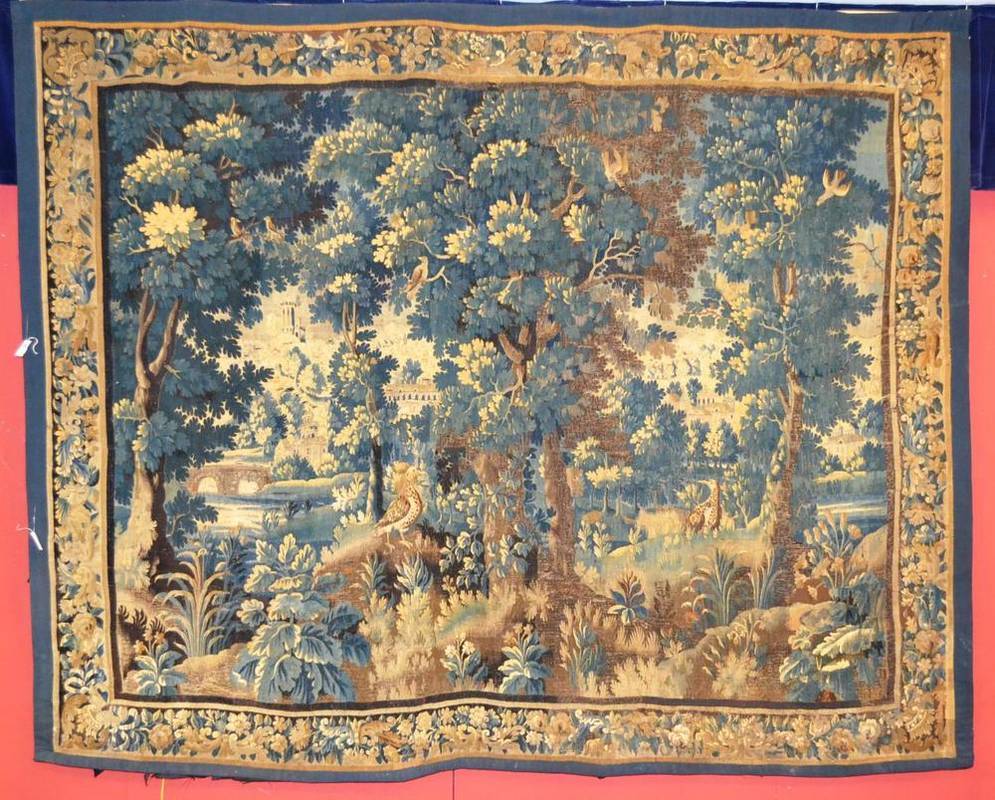 Lot 1267 - A Late 17th/Early 18th Century Flemish  "Verdure " Tapestry  Woven in silk and wools depicting...