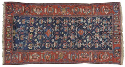 Lot 1270 - Bakhtiari Rug West Persia The indigo lattice field of stylised flowerheads enclosed by brick...