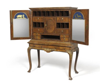 Lot 1302 - A Queen Anne Style Walnut and Oyster Veneered Chest on Stand, the rockwork gesso cornice above...