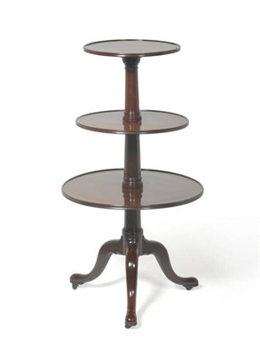 Lot 1307 - A George III Mahogany Three-Tier Dumb Waiter, late 18th century, of graduated form with turned...