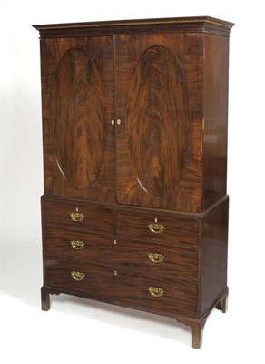 Lot 1312 - A George III Mahogany Linen Press, late 18th century, the chequer banded inlaid frieze above...