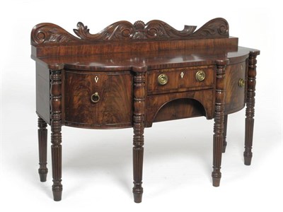 Lot 1327 - A William IV Mahogany Breakfront Sideboard, circa 1835, with acanthus carved gallery and staged top