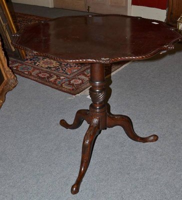 Lot 1351 - A George III Style Mahogany Pie Crust Tripod Table, bearing plaque of S & H Jewell, 131-132...