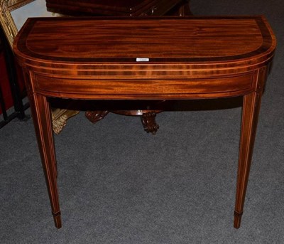 Lot 1356 - A George III Mahogany, Tulipwood, Kingwood and Boxwood Strung Foldover Card Table, circa 1800,...