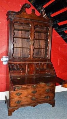 Lot 1361 - A George III Mahogany Bureau Bookcase, late 18th century, the swan neck pediment and dentil cornice