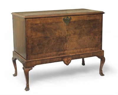 Lot 1367 - A George II Walnut and Featherbanded Chest on Stand, early 18th century, the hinged lid with...