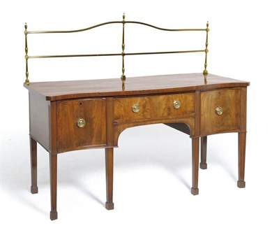 Lot 1381 - A Late George III Mahogany Serpentine Shaped Sideboard, early 19th century, the elegant brass...