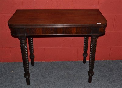 Lot 1383 - A George IV Mahogany Foldover Tea Table, 2nd quarter 19th century, of rounded rectangular form with