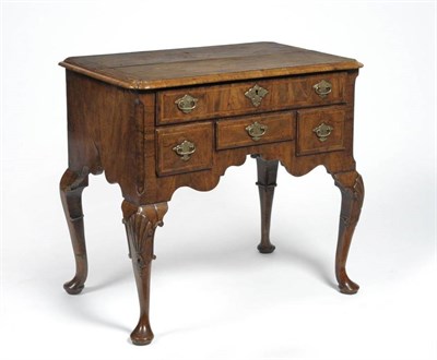 Lot 1384 - A Walnut, Crossbanded and Feather Banded Dressing Table, the rectangular top with re-entrant...