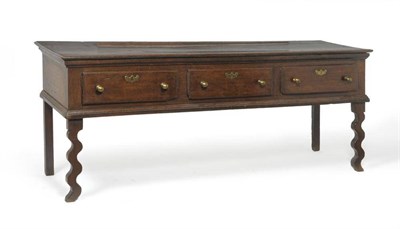 Lot 1388 - An Early 18th Century Joined Oak Sideboard Dresser, the moulded top above three frieze drawers,...