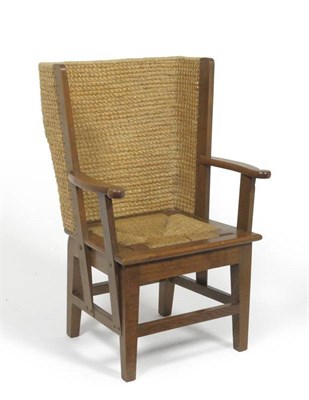 Lot 1390 - An Early 20th Century Child's Orkney Chair, with oak frame, curved rush back support and seat,...