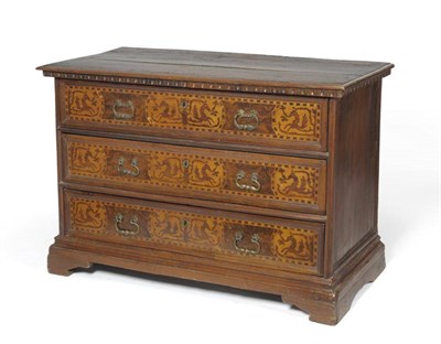 Lot 1404 - A Late 17th Century Italian Provincial Walnut Commode, the carved frieze above three long...