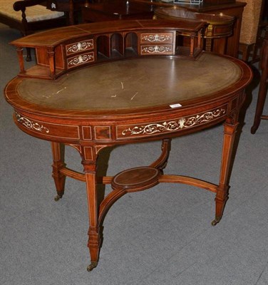 Lot 1414 - A Late Victorian Rosewood and Bone Inlaid Oval Writing Table, circa 1900, the superstructure fitted