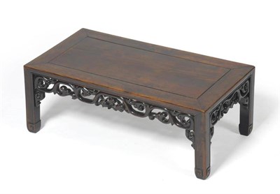 Lot 1430 - A Chinese Padouk Wood Waisted Kang Table, early 20th century, of rectangular form with foliate...