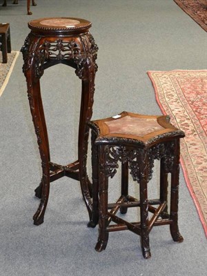 Lot 1432 - A Chinese Padouk Wood Plant Stand, early 20th century, the circular pink marble top above a foliate