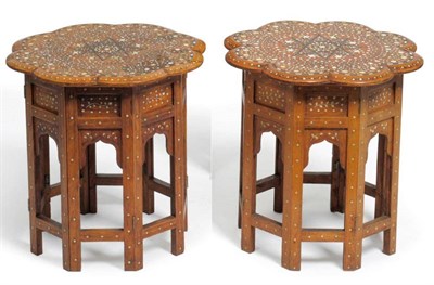 Lot 1435 - A Near Pair of Islamic Inlaid Ivory and Ebony Occasional Tables, early 20th century, of moulded...