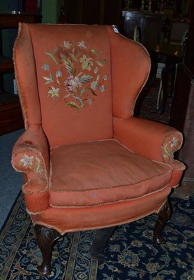 Lot 1449 - An 18th Century Style Wing Back Chair, upholstered in orange and floral needlework fabric, with...