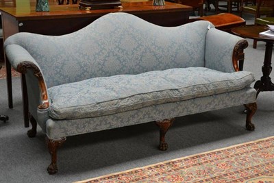 Lot 1458 - A 20th Century Carved Mahogany Hump-Back Settee, upholstered in blue floral silk damask, the...