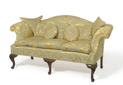 Lot 1459 - An Early 20th Century Carved Mahogany Three-Seater Settee, recovered in yellow and green floral...