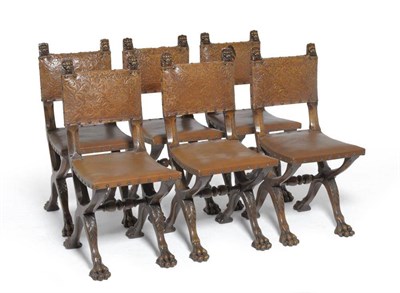 Lot 1477 - A Set of Six Early 20th Century Walnut Framed Dining Chairs, upholstered in brown studded...