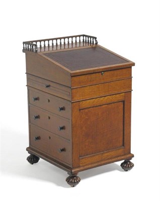 Lot 1510 - A Gillows of Lancaster Oak Davenport, circa 1825, craftsman John Herbert, with a three-quarter...