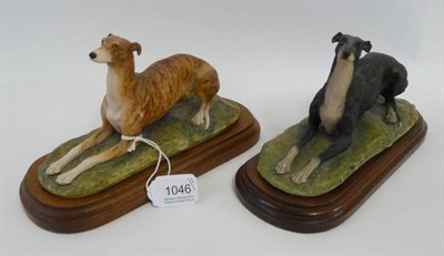 Lot 1046 - Two Border Fine Arts 'Greyhounds', models 064A brindle and 064B black and white, by David...