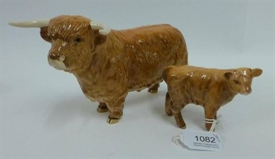 Lot 1082 - A Beswick Highland bull and calf