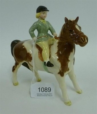 Lot 1089 - Beswick Girl on Skewbald Pony, model No. 1499, gloss, 14cm high