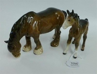 Lot 1098 - Beswick Brown Grazing Shire Mare and Foal, mare, model No. 1050, gloss, 14cm high and brown...