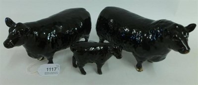 Lot 1117 - Beswick Aberdeen Angus Bull, Cow and Calf, models 1562, 1563 and 1827A, all black gloss (3)