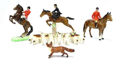 Lot 1036 - Beswick Fox Hunting Group Comprising: Beswick Huntswoman on Jumping Horse, model No. 982, brown...
