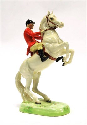 Lot 1044 - Beswick Huntsman on Rearing Horse, model No. 868, painted white, gloss (ear re-glued)