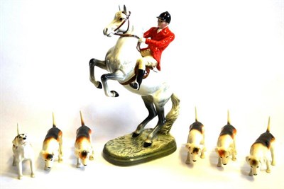 Lot 1138 - Beswick Huntsman on Rearing Horse, model No. 868, grey gloss and six foxhounds (7)