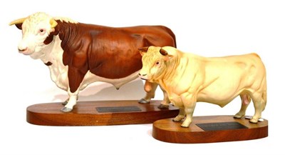 Lot 1071 - Beswick Hereford Bull, model No. 2542A, on wooded plinth; Beswick Charolais Bull, model No. A2463A