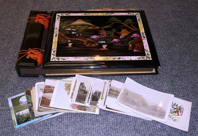 Lot 347 - A Japanese Black Lacquered Musical Postcard Album, containing a selection of mixed post war...