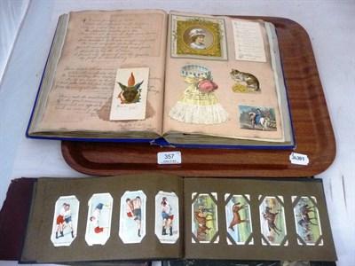 Lot 357 - A Victorian Scrap Book, containing die-cut scraps, greetings cards, stamps etc;Three Albums of...