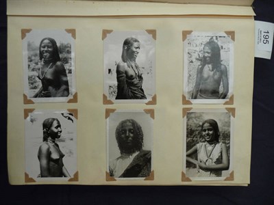 Lot 195 - An Album of Snapshot Photographs and Postcards of African Tribal People, also topography and...