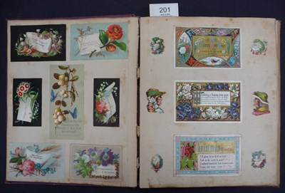 Lot 201 - A Victorian Scrap Book, containing die-cut scraps, greetings cards and cuttings