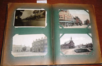 Lot 161 - An Album of Pre-War Postcards, containing two hundred cards, including social history, real...