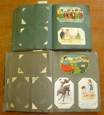 Lot 174 - Two Albums of Mainly Comic Postcards, containing approximately two hundred and thirty cards,...