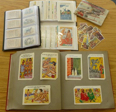Lot 197 - Two Albums of Saucy Seaside Postcards, together with an album of silk Best Dog Breed cigarette...