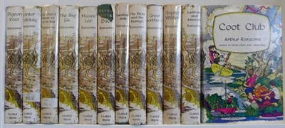 Lot 19 - Ransome (Arthur) The Swallows and Amazons Series. A collection of Canadian editions,...