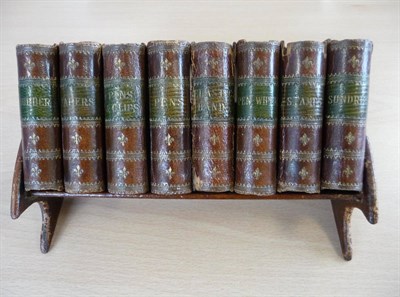 Lot 161 - Desk Set Eight small storage boxes in book form, for tapers, pens, stamps, pins and clips,...