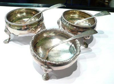 Lot 2 - Three George III silver cauldron salts and three ill-matched spoons, approx 6oz