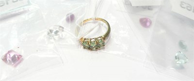 Lot 17 - A tsavorite garnet ring and assorted loose gemstones including aquamarines, pink topaz etc  Subject