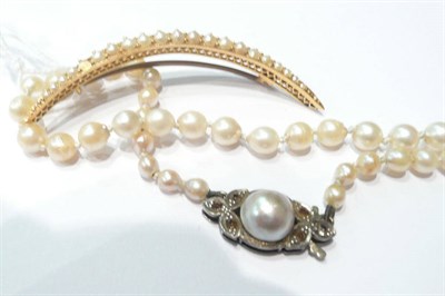 Lot 19 - A split pearl set crescent brooch (a.f.) and a graduated cultured pearl necklace