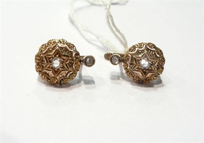Lot 21 - A pair of earrings set with rose cut diamonds