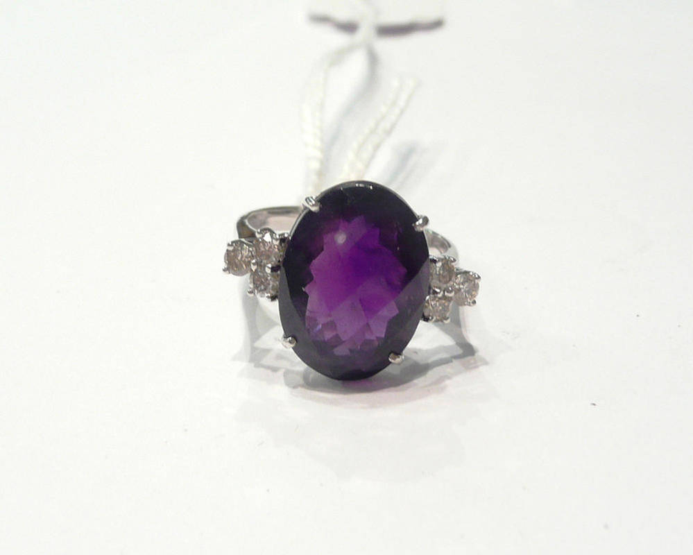 Lot 33 - A 14 carat white gold amethyst and diamond ring